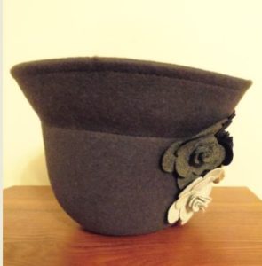 Gray felt hat turned upside down.