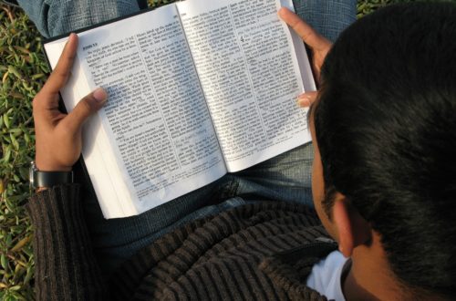 Bible read by teen boy