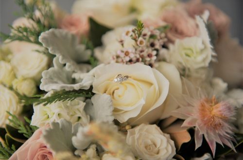 Floral bouquet with diamond ring in center