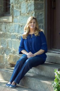 Sally Matheny sitting on a door step