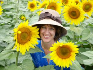 Laura Sassi in field of sunflowers