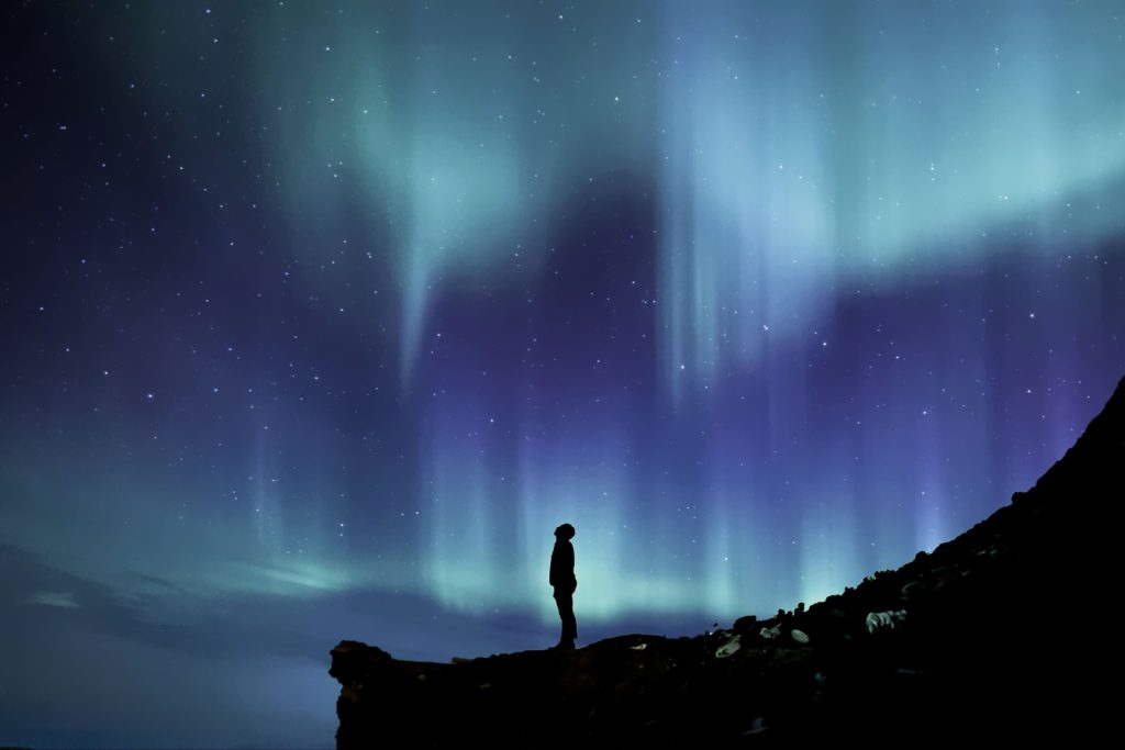 Starry night sky with man looking up. "Fear not!"