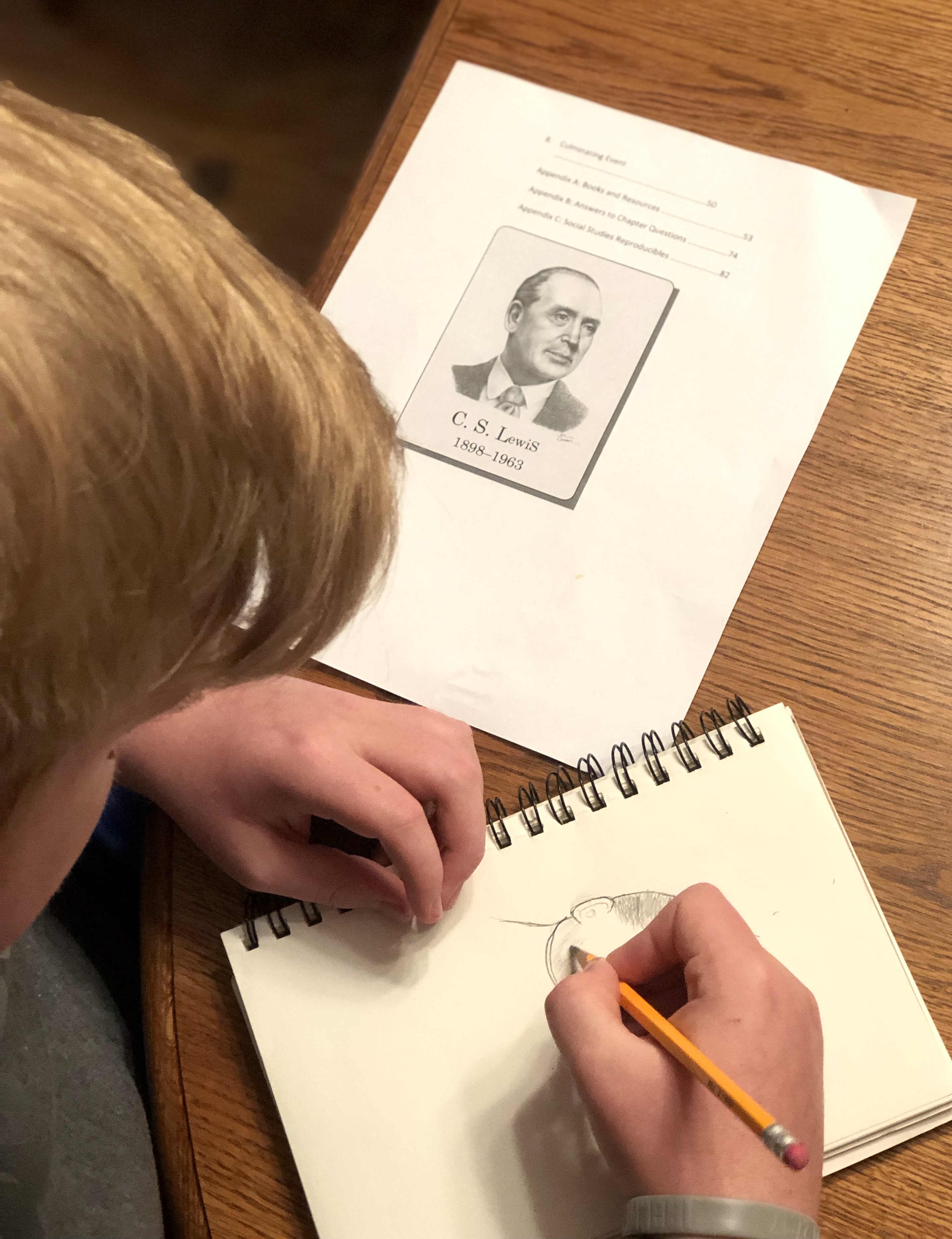 My son sketching a portrait of C.S. Lewis.