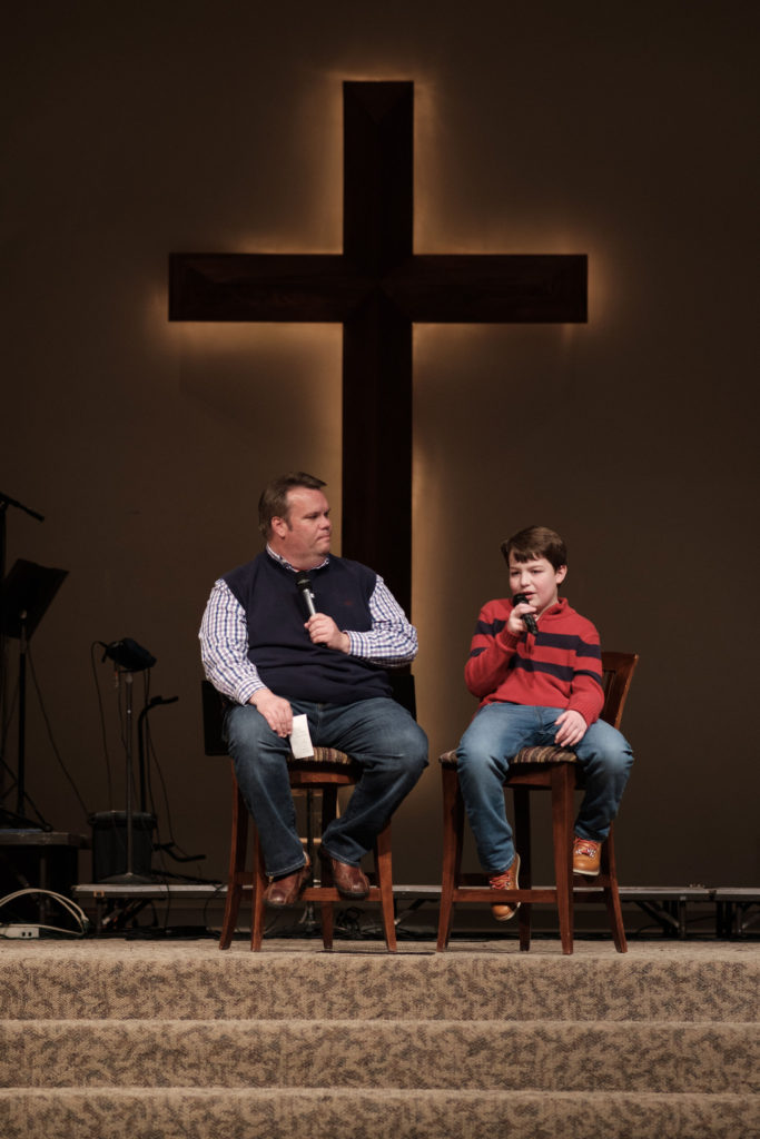 "A Forever Family via Foster Care" by Cecil Stokes- Photo of Cecil and Boone Stokes speaking at a church.