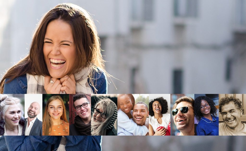 Woman and several other people smiling.