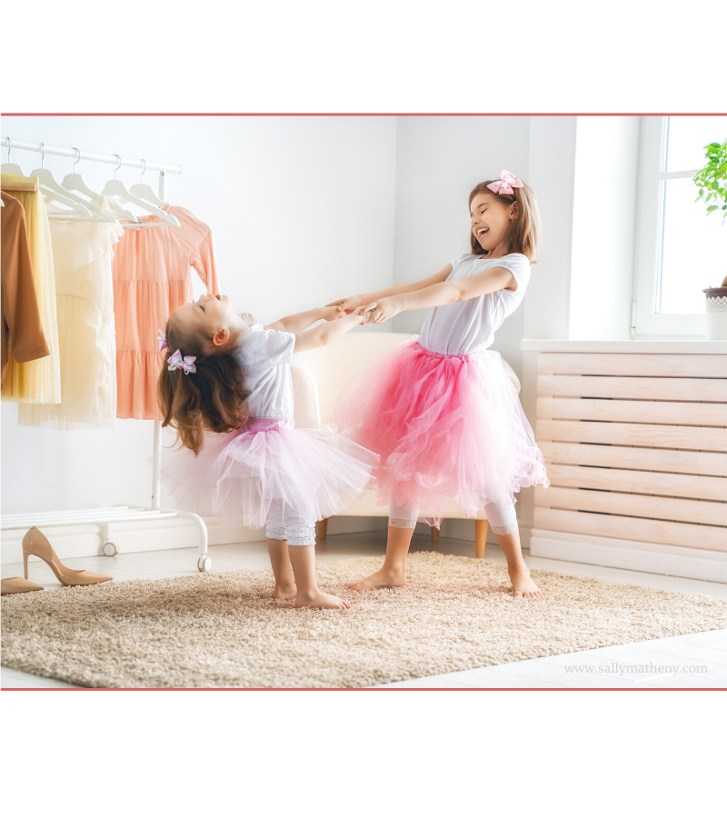 Prepare these little girls now for future weddings. Shows girls twirling in dress-up clothes.   Canva, 2021.