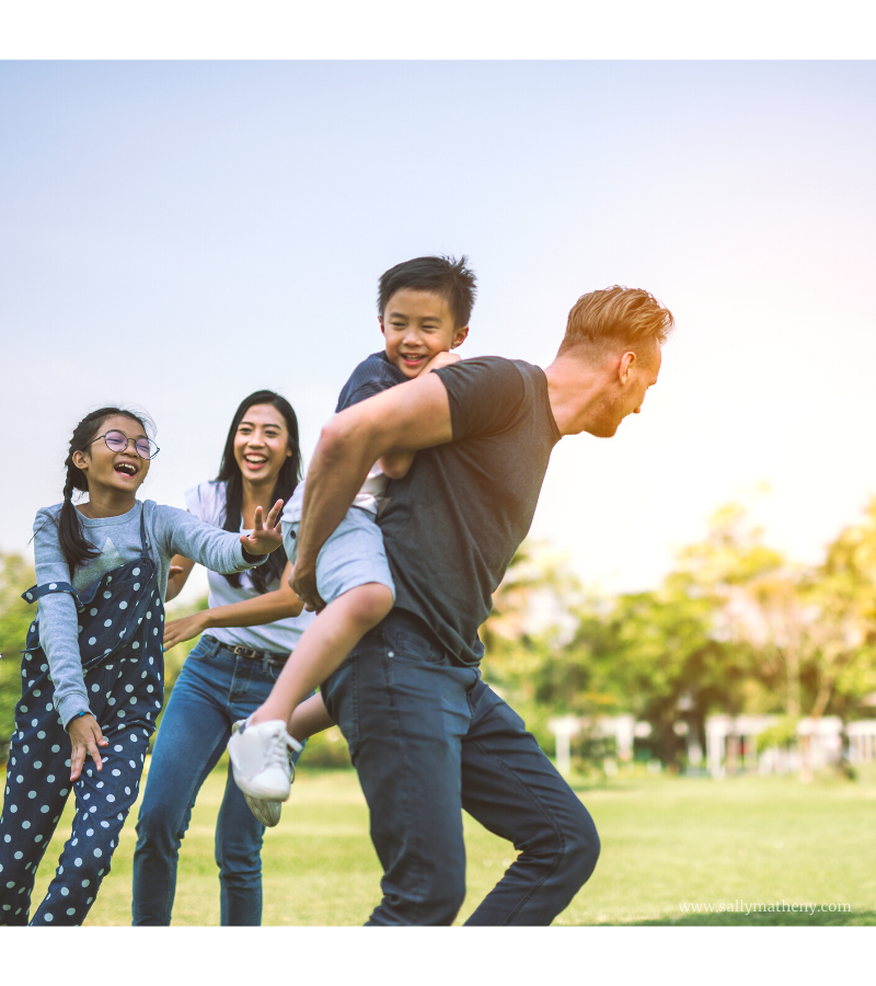 A family playing tag outside.