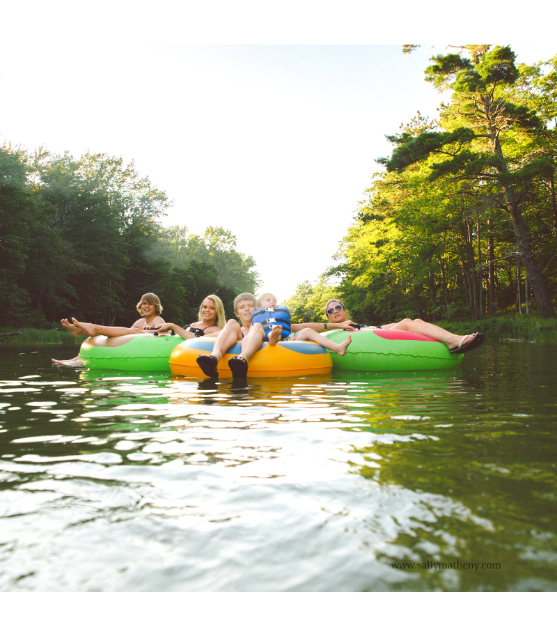Family tubing down a river.