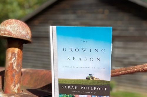 The Growing Season book sitting on Sally Matheny's old tractor.