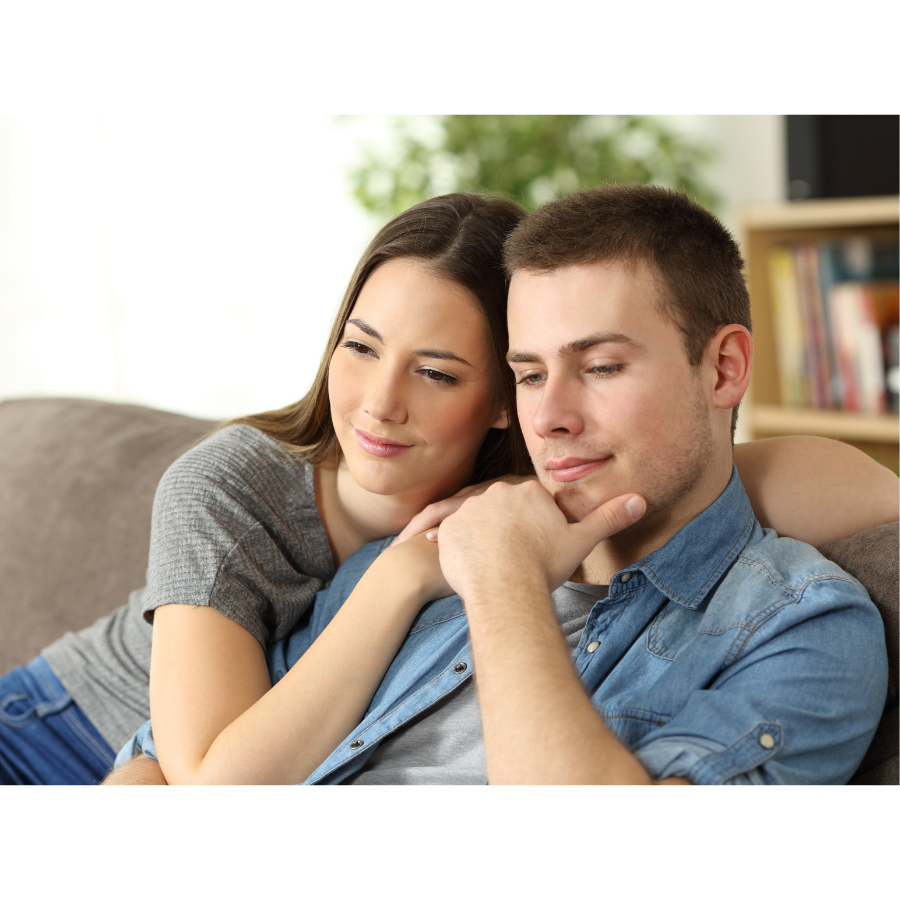 Husband and wife smiling together.