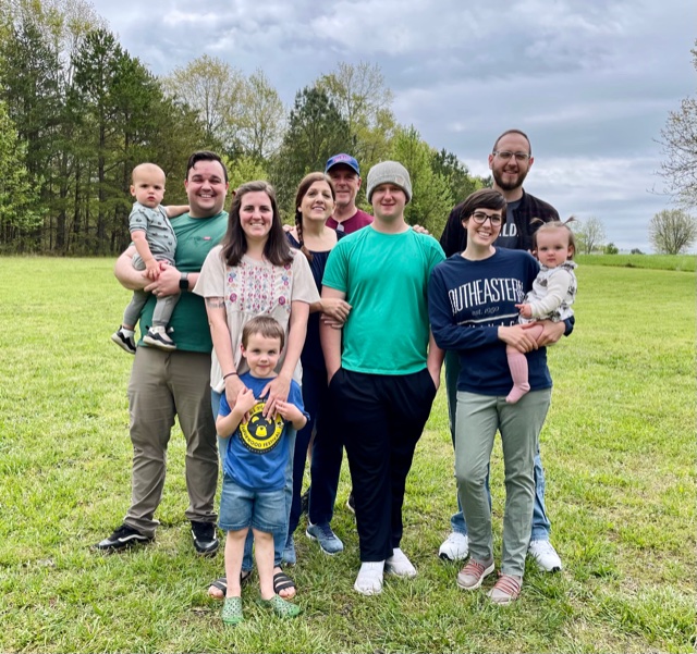 Sally Matheny and family standing outside in the pasture. Photo rights- S. Matheny