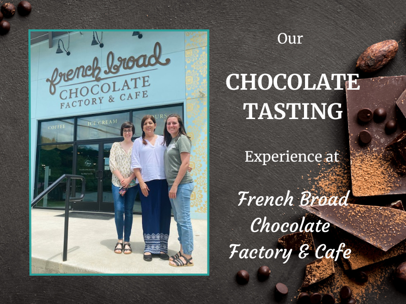 Shows Sally Matheny and her daughters standing in front of the French Broad River Chocolate Factory.