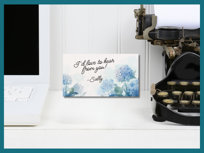 computer to the left, old typewriter to the right. Calling card in the middle with note: "I'd love to hear from you. - Sally"