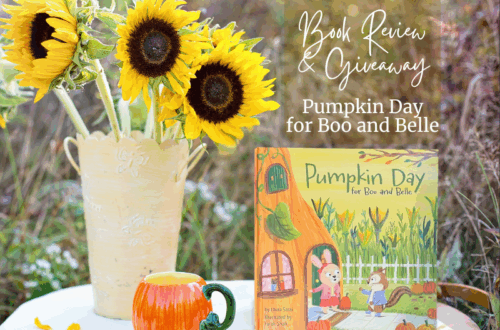 Table with sunflowers, pumpkin shaped teacup and the book: PUMPKIN DAY WITH BOO AND BELLE
